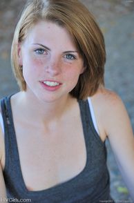 Sweet Red Hair Girl With Freckles On Her Face