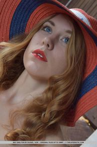 Sultry Blue Eyes Redhead In A Hat