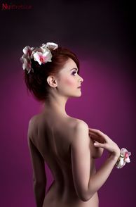 Red Hair On Pretty Model Wearing Flowers